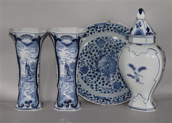 An 18th century Delft dish and a modern Delft three piece garniture